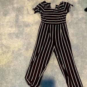 Selling a black and white jumper. Never worn and is provided with tags